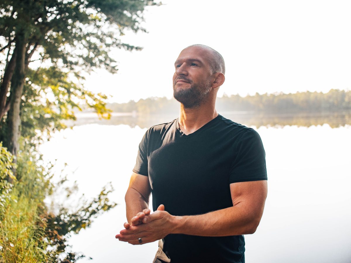 Chris Matakas by a lake in the woods