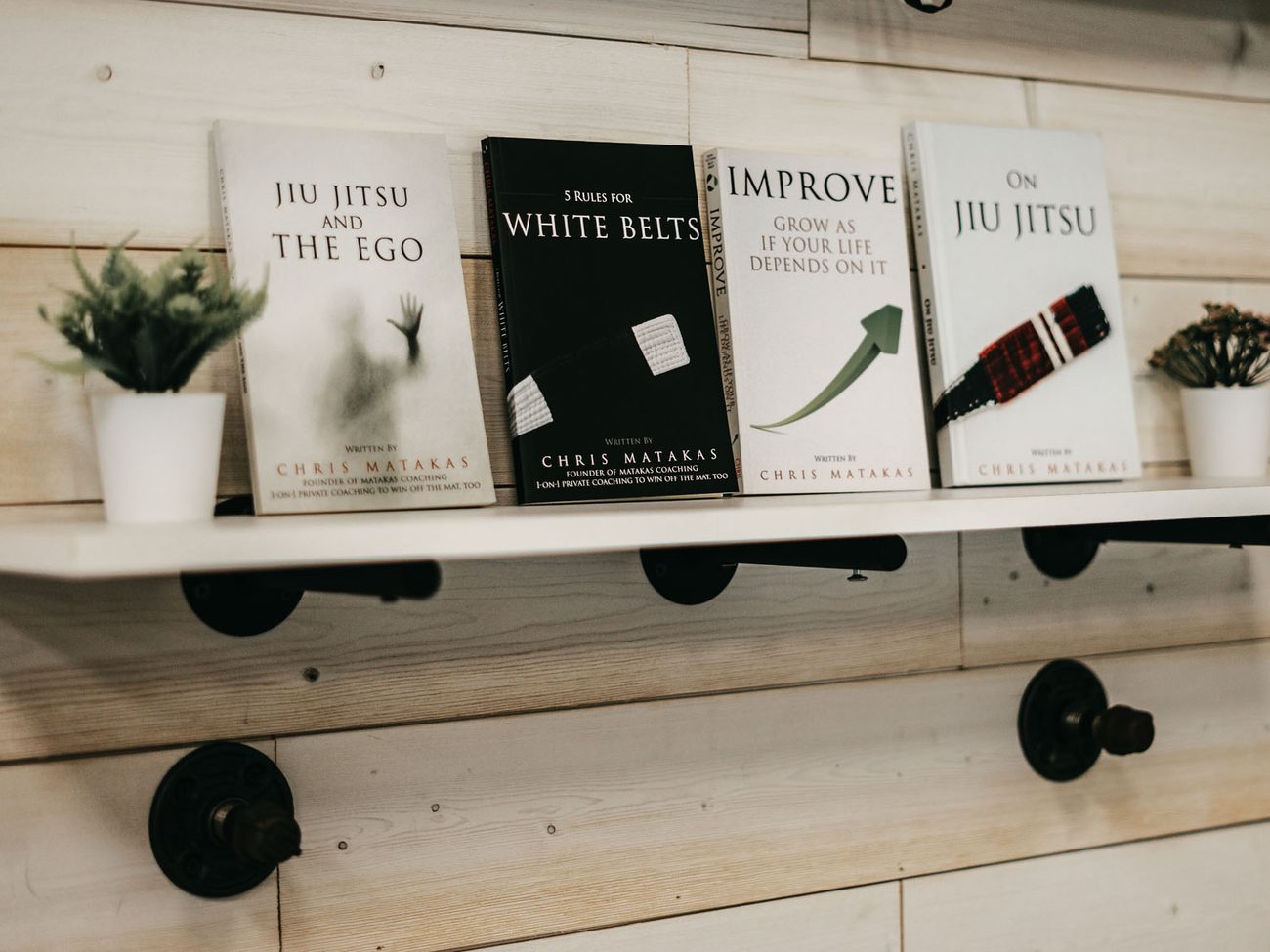 Four of Chris Matakas books on a shelf
