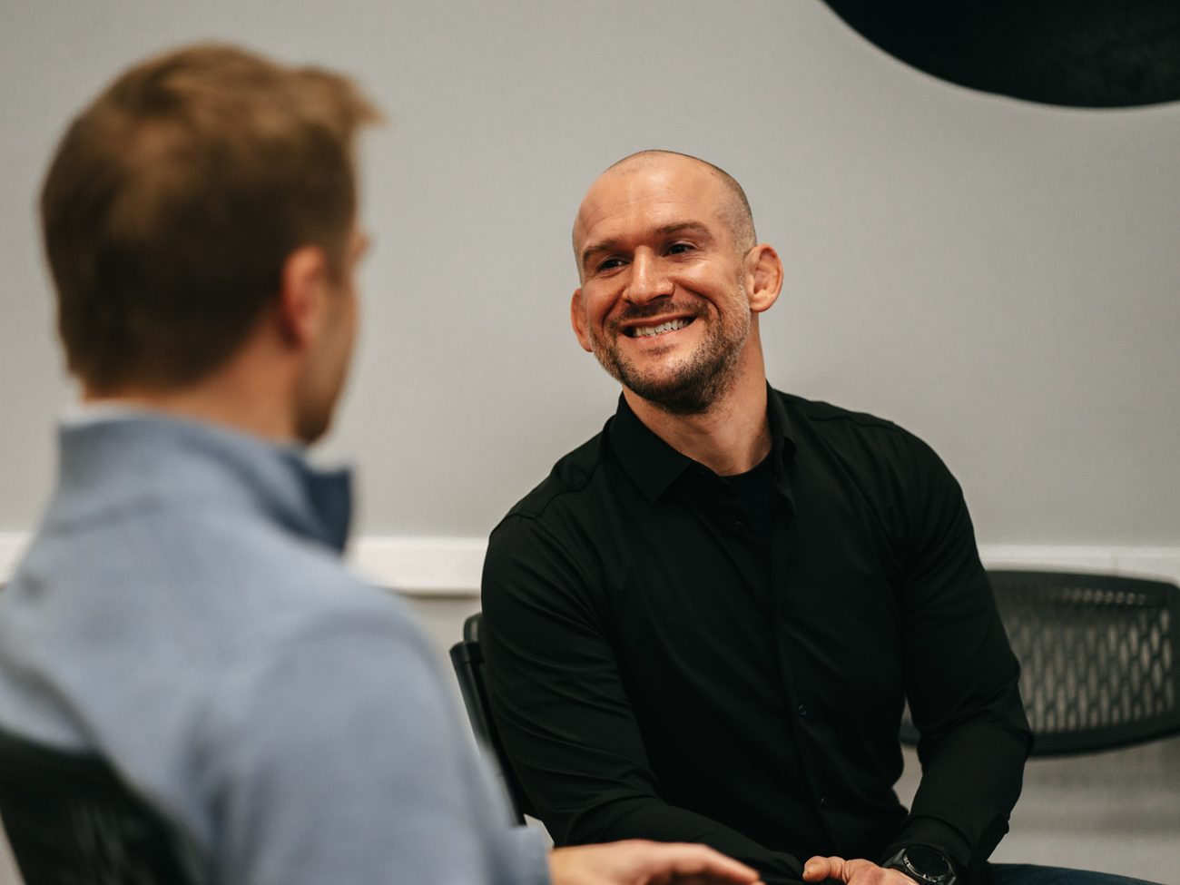 Chris Matakas laughing with a coaching client