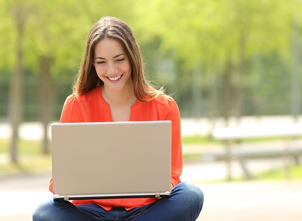 woman-sitting-at-computer-outdoors